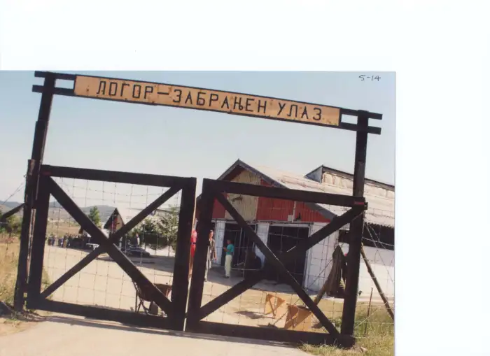 The Sign reads CONCENTRATION CAMP. PROHIBITED ENTRY. Photo: Entrance to the Manjaca concentration camp near Prijedor, north-west Bosnia, where Serbs interned, tortured, raped, and killed thousands of Bosniaks (Bosnian Muslims). 